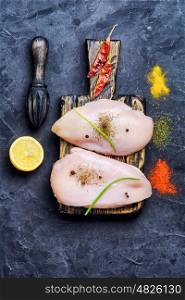 chicken raw breast. chicken raw fillets on kitchen plate with spices