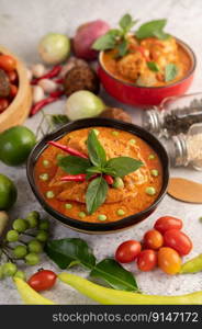 Chicken red curry in a black bowl, chilli, tomato, galangal, shiitake mushroom and eggplant