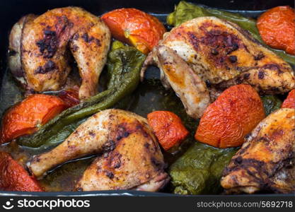 Chicken roasted with tomatoes and long sweet peppers