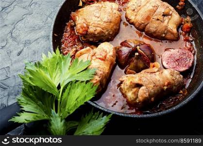 Chicken rolls with figs in wine sauce.Chicken fricassee. Chicken breast roll roast with figs