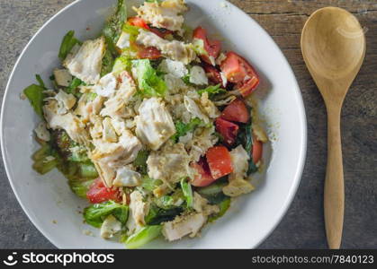 Chicken salad with tomatoes , bread and mix vegetables