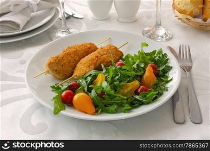 Chicken Schnitzel with arugula and cherry tomatoes