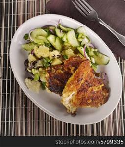 Chicken Schnitzel With Potato Salad And Cucumbers