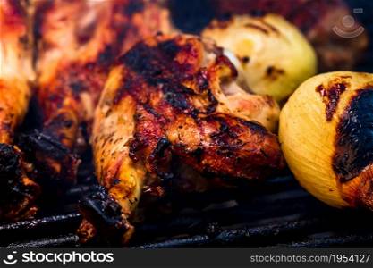 Chicken steak grilled and meat rolls on a charcoal barbeque. Top view of camping tasty barbecue, food concept, food on grill and detail of food on the grill