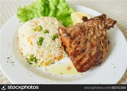 Chicken Steak with rice And Lettuce on white plate