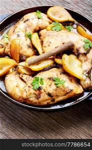 Chicken stewed in pear sauce.Autumnal meat dish. Chicken stewed in pear