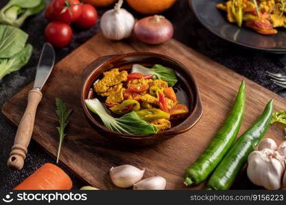 chicken Stir Fried Chili Along with bell pepper Tomatoes and carrots.