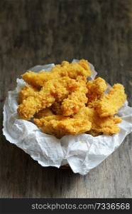 Chicken strips on rustic wooden table