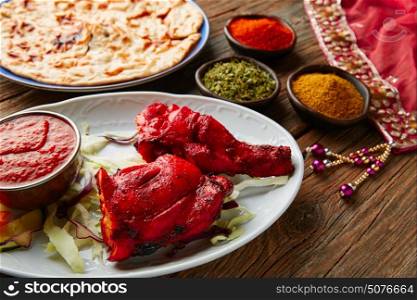 Chicken Tandoori indian recipe with spices on wood