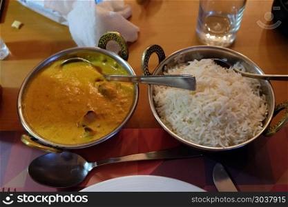 Chicken tika masala with white rice in One Step Up restaurant in Kolkata, West Bengal, India
