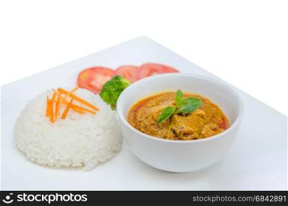 chicken tikka masala . chicken tikka masala served with rice and vegetables