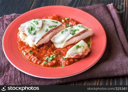 Chicken with pepperoni and tomato sauce