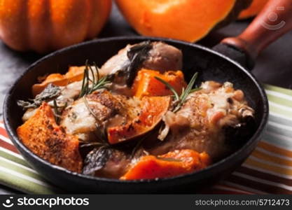 Chicken with pumpkin baked in frying pan