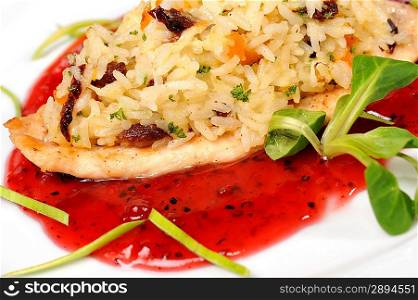 Chicken with rice in cowberry sauce