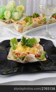 "Chicken with tomatoes and cheese in a basket made of dough "phyllo""