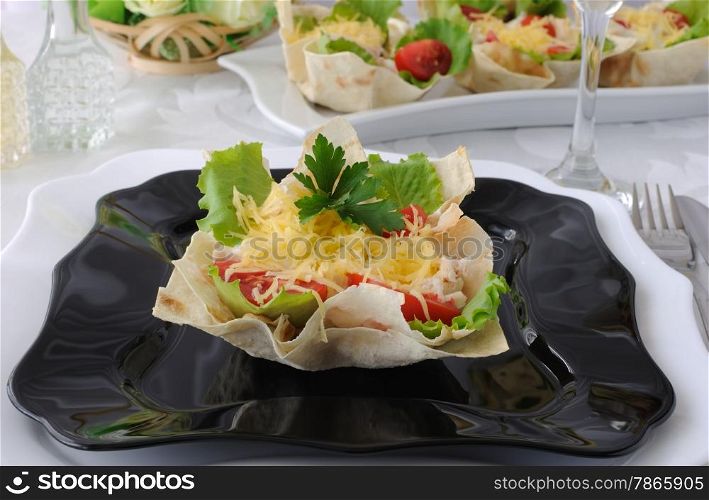 "Chicken with tomatoes and cheese in a basket made of dough "phyllo""