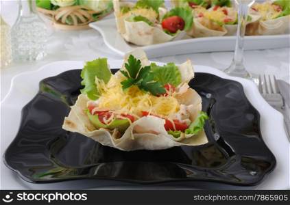 "Chicken with tomatoes and cheese in a basket made of dough "phyllo""