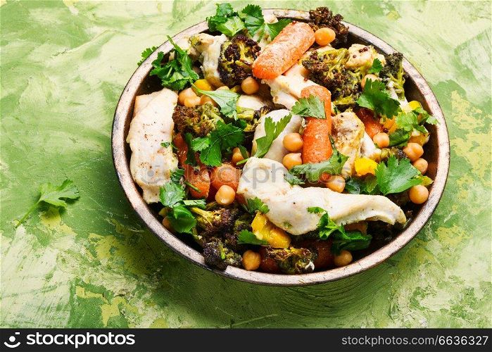 Chicken with vegetables and chickpeas in Indian.Indian kitchen. Chicken with vegetables and spicy