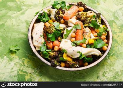 Chicken with vegetables and chickpeas in Indian.Indian kitchen. Chicken with vegetables and spicy