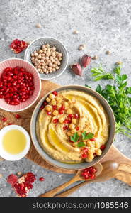 Chickpea hummus with tahini in a bowl. Healthy vegetarian appetizer. Middle Eastern cuisine