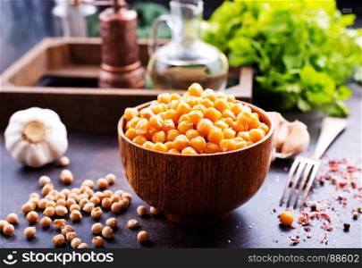 chickpeas in bowl and on a table