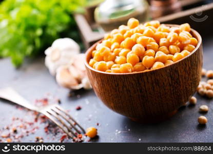 chickpeas in bowl and on a table