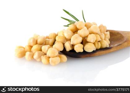 Chickpeas over wooden spoon on white background.