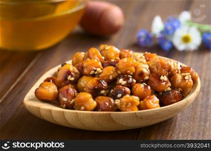 Chickpeas roasted with sesame and honey, photographed with natural light (Selective Focus, Focus on the chickpeas on the top)