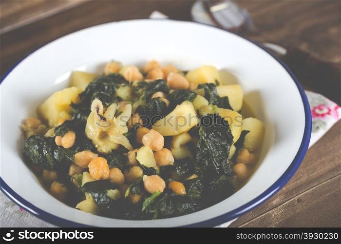 Chickpeas stewed with sepia spinach and potatoes