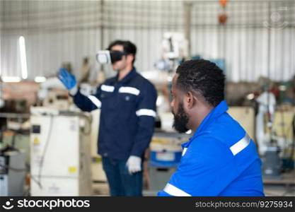 Chief and young male engineer uses a VR machine to operate a welding robot. for precision welding control that is both quick and safe