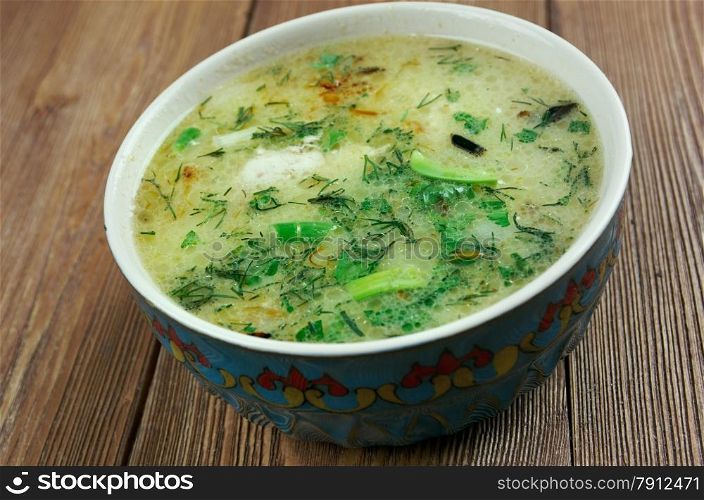 Chikhirtma - traditional Georgian soup. made with rich chicken broth, which is thickened with beaten eggs