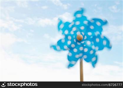 Child&acute;s plastic windmill turning in wind
