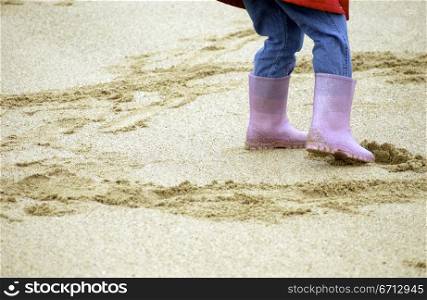 child&acute;s welly boots on beach