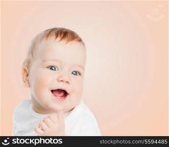 child and happiness concept - smiling baby