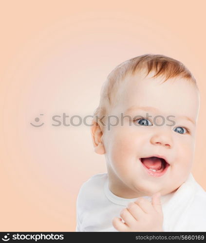 child and happiness concept - smiling baby