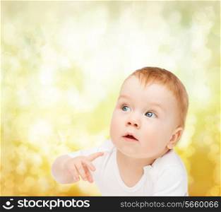 child and toddler concept - curious baby looking side