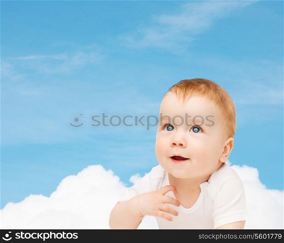 child and toddler concept - smiling baby looking up