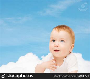 child and toddler concept - smiling baby looking up