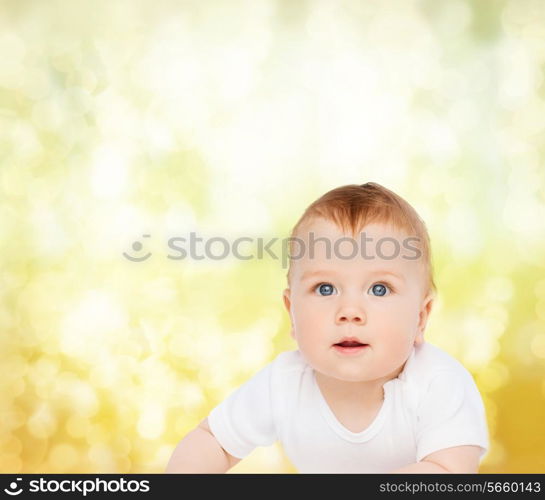 child and toddler concept - smiling baby looking up