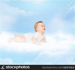child and toddler concept - smiling baby lying on cloud and looking up