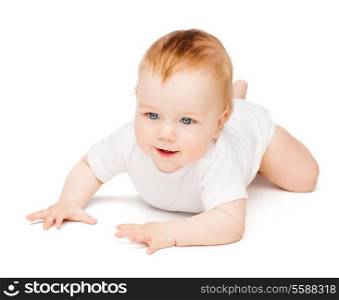 child and toddler concept - smiling baby lying on floor
