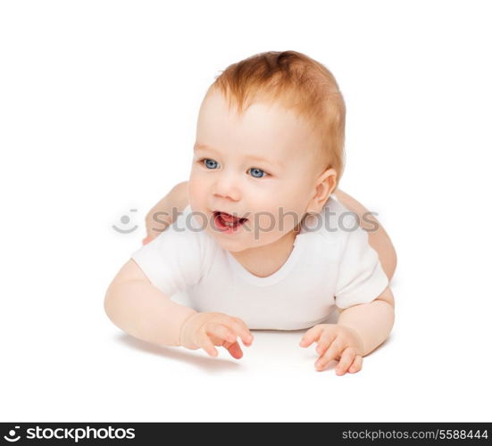 child and toddler concept - smiling baby lying on floor