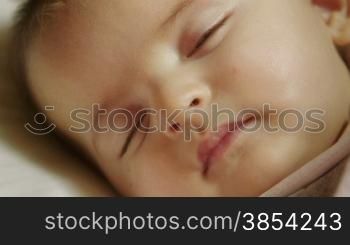 Child at home, cute baby girl sleeping in crib in bedroom