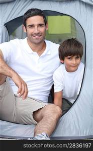 Child camping with his father