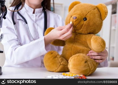 Child checking soft toy health