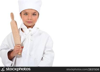Child chef with a rolling pin