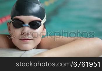 child competing in a swimming race