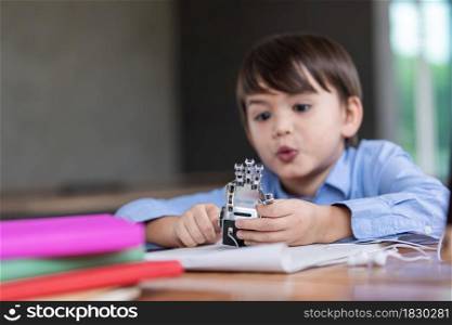 Child doing using digital tablet searching information on internet during covid 19 lock down,Home schooling,Social Distance,E-learning online education