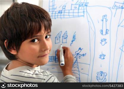 Child drawing a street scene