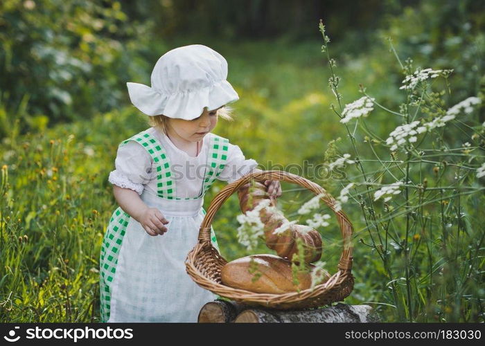 Child dress food boy walks in the garden.. Little girl in vintage dress walking in the garden 4628.